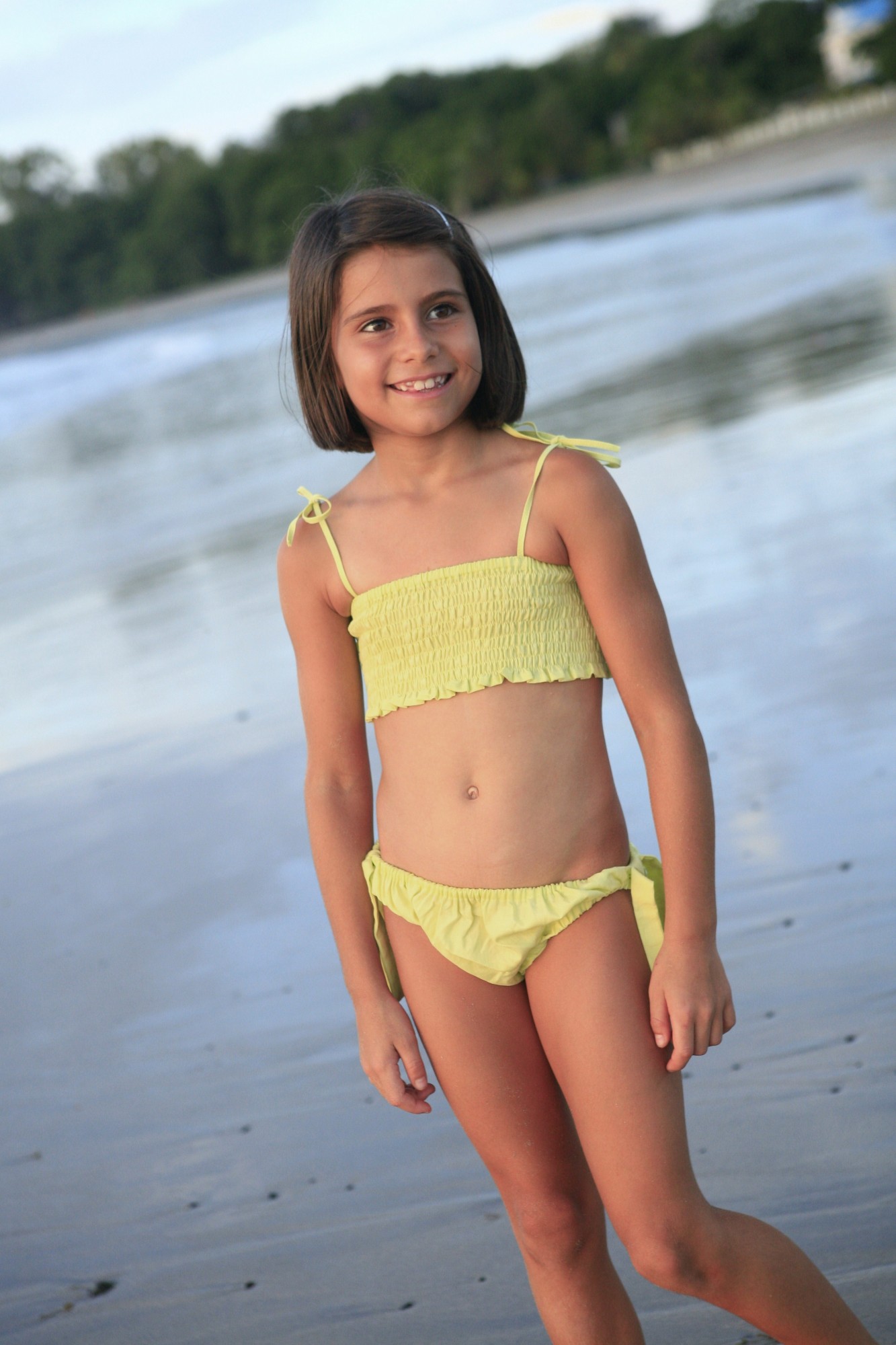 young girl in yellow bikini